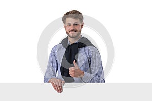 Man shows thumbs up holding banner