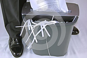 Man shredding paper photo
