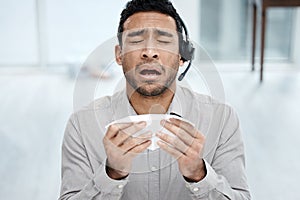 Man, sick and cold at call center with headset or tissue sneeze for customer support, telemarketing or allergy. Asian