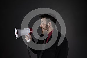 Man in Side View Holding Megaphone