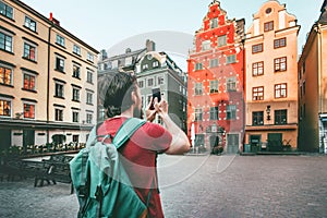 Man sightseeing Stockholm city Stortorget landmarks