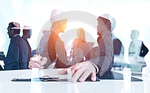 Man signing document, business team