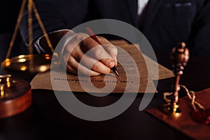 Man signing a Last Will and Testament document