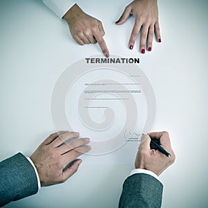 Man signing a termination document