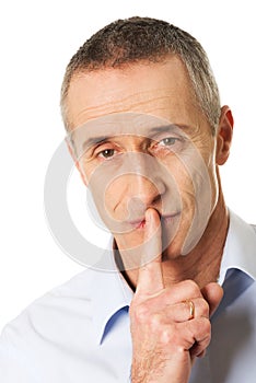 Man with silent gesture