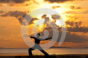 Man silhouette doing yoga exercise archer