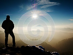 Man silhouette on sharp peak. Satisfy hiker enjoy view