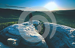 Man silhouette stay on sharp peak. Satisfy hiker enjoy view