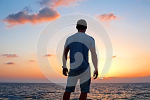 Man silhouette at sunset near the sea