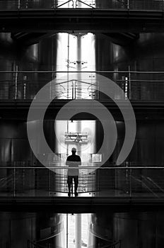 Man silhouetted on balcony