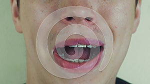 Man sing song pronounce words in front camera. Open mouth. White teeth. Smile