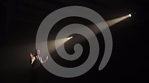 Man singing lyrical song surrounded with dramatic lighting