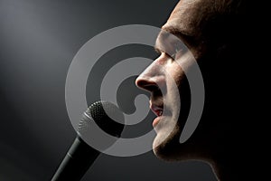 Man singing to microphone