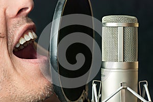 Man Sings Into Condenser Microphone, Close