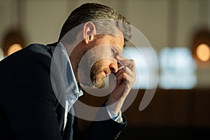 Man with sinus headache, tension or cluster headache, close up portrait. Head pain concept. Cephalalgia and migraine photo