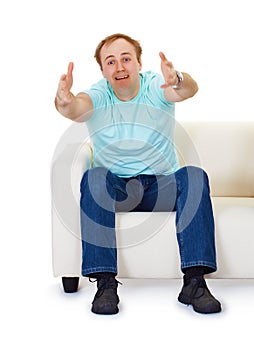 Man sits on couch in despair