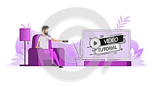 Man sits on the couch, they switch the channel on the TV. Video tutorial icon