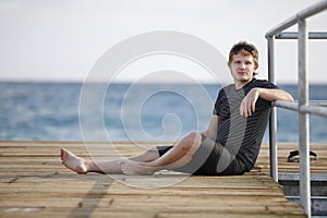 A man sits on the dock