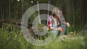 Man sits in front of bonfire