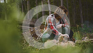 Man sits in front of bonfire