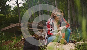 Man sits in front of bonfire