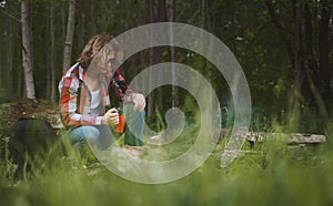 Man sits in front of bonfire
