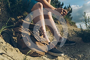 Man sits on the ground chating on the phone