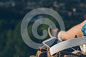 Man sits on the ground chating on the phone