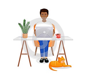 Man sits at a table, works at a computer at home. Remote work, freelance, home office, programming, training. Cozy