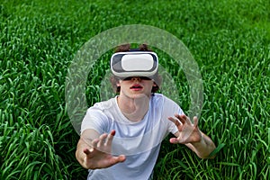 a man sits in virtual reality glasses