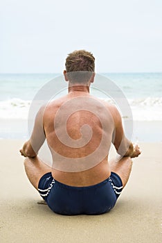 Man sitting on beach.