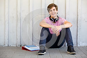 Man sitting with books