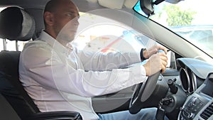 A man sitting in a car