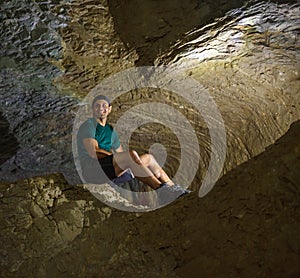 Man sitting in a cave