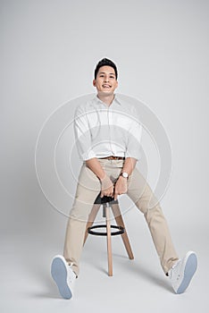 Man sitting on the chair in studio