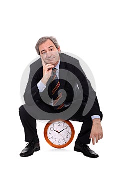 Man sitting on clock