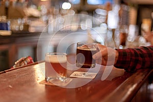 Man sitting at counter having a beer