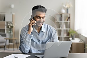 Man sitting at desk lead talk to client by phonecall