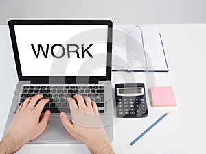 man sitting at a desk and working at a computer with his hands, Office desktop on a white background