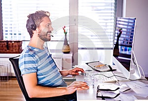 Man sitting at desk working from home on computer