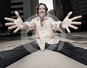 Man sitting and extending his arms