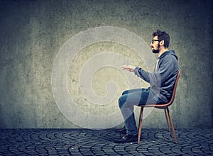 Man sitting at imaginary table