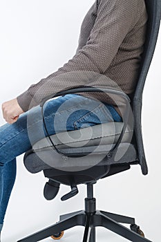 man sitting on an inflatable ring cushion