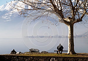 Man sitting by Lake Como