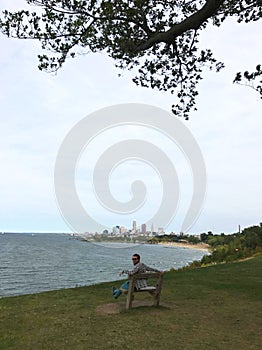 A man sitting by the lake