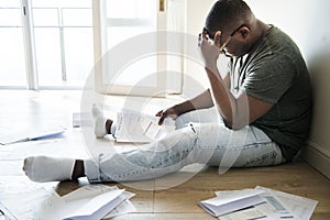 Man sitting and managing the debt