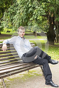 Man sitting and relaxing on a bench.