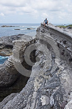 Man sitting rock Shihtiping, Taiwan