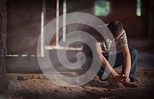 Man sitting on sandy floor