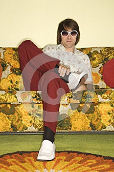 Man sitting on sofa.